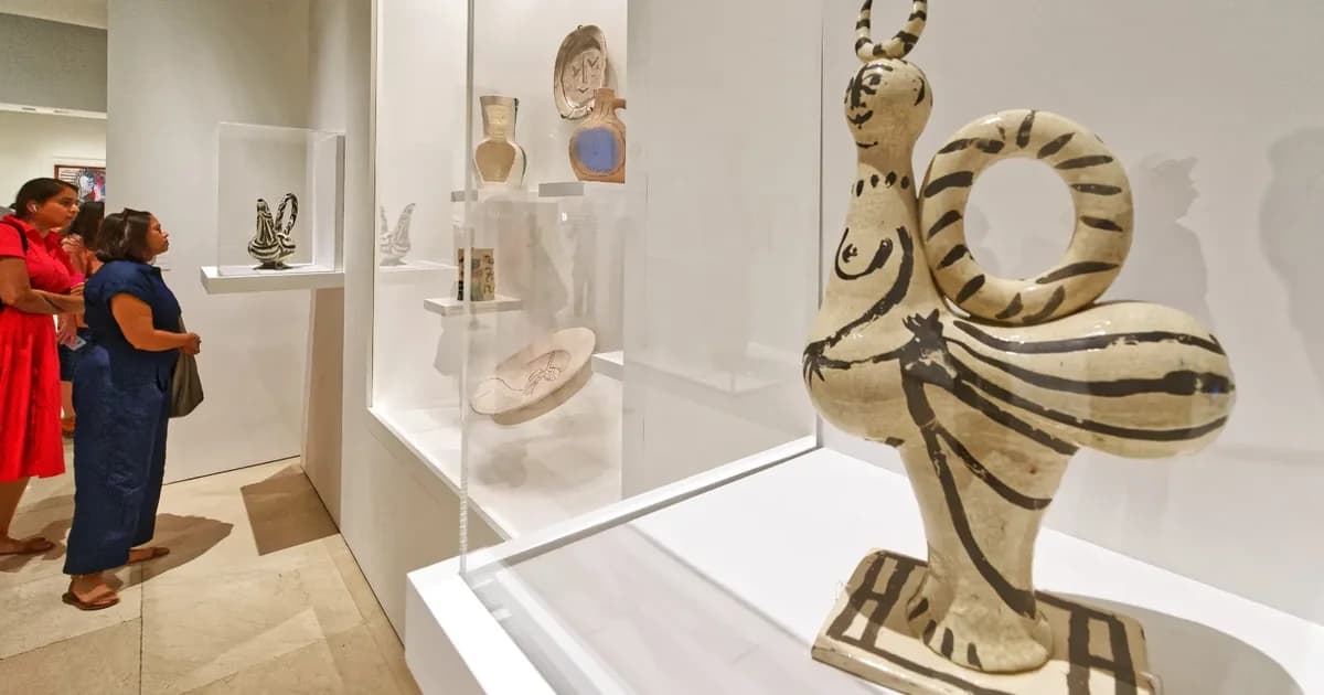 Visitors admiring Picasso ceramics and sculptures at the Malaga Picasso